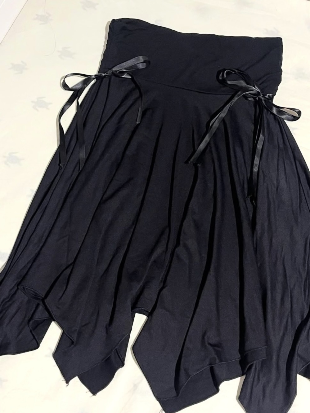 Pretty Girl black handkerchief-hem skirt with ribbon ties